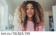 Radiant Smile: A young woman's joyful greeting in a pink sweater. Стоковое AI-видео, аниматор Данила Большаков / Фотобанк Лори