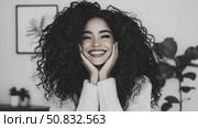 Radiant Joy: Portrait of a Smiling Woman with Curls. Стоковое AI-видео, аниматор Данила Большаков / Фотобанк Лори
