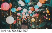 Dreamlike Outdoor Corridor with Glowing Orb Lights and Lush Tropical Plant Life. Стоковое AI-видео, аниматор Данила Большаков / Фотобанк Лори
