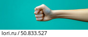 Fist clenched in determination: A symbol of strength and resolve, for motivational poster or empowerment campaign. Стоковое AI-изображение, AI-художник Данила Большаков / Фотобанк Лори