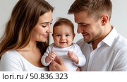 Happy young parents look at their smiling newborn baby with love and care. Стоковое AI-изображение, AI-художник Ирина Гильмуллина / Фотобанк Лори