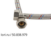 Сантехнический шланг в металлической оплетке для воды на белом фоне. Plumbing hose in a metal braid for water. Стоковое фото, фотограф Татьяна Д / Фотобанк Лори