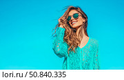 Sun-Kissed: Summer bliss, a smiling woman in aqua lace dress and mirrored shades enjoys a vibrant day, a portrait for lifestyle. Стоковое AI-изображение, AI-художник Данила Большаков / Фотобанк Лори