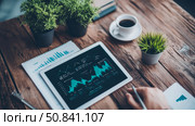 Financial Analysis: Charting Growth & Strategy on digital tablet, desk setting. Стоковое AI-изображение, AI-художник Данила Большаков / Фотобанк Лори