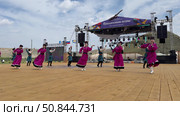 ELANTSY, IRKUTSK REGION, RUSSIA - July 5, 2025: Erdyn Games - festival of nomadic peoples of Eurasia. Video of group of Buryat youths and girls in national costumes dancing fiery folk dance on open stage. Редакционное видео, видеограф Виктория Катьянова / Фотобанк Лори