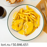 Stewed hake Merluza en salsa holandesa with potatoes. Стоковое фото, фотограф Яков Филимонов / Фотобанк Лори