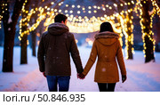 A couple is walking hand in hand in the snow. Стоковое AI-изображение, AI-художник Ярославский Максим / Фотобанк Лори