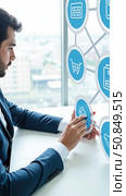 Payroll Management and Financial Processing System. Businessman works on payroll management with icons for payment, employee salaries, scheduling, analysis finance, and efficient planning. Стоковое AI-изображение, AI-художник Sergey Grishin / Фотобанк Лори