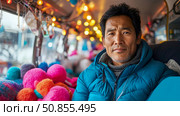 Intimate Portrait of a Man in a Padded Jacket amid Lights and Soft Balls, for Warmth Concept. Стоковое AI-изображение, AI-художник Данила Большаков / Фотобанк Лори