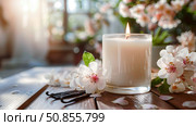 Mock up scented candle fills the air with soothing floral and vanilla aroma, surrounded by delicate blossoms and fragrant spices, creating a serene and inviting ambiance. Copy space. Стоковое AI-изображение, AI-художник Юлия Ильина / Фотобанк Лори