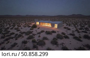 Warm lights illuminating minimalist desert home, contrasting against dark starry sky, radiating peaceful solitude within stark landscape. Стоковое AI-видео, аниматор Данил Руденко / Фотобанк Лори