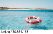Summer Escape: A Life Saver Buoy in Tranquil Turquoise Waters. Стоковое AI-изображение, AI-художник Данила Большаков / Фотобанк Лори