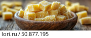 Parmesan Perfection: Cubes of aged cheese in a rustic wooden bowl, a culinary delight for gourmet cheese platters and savory snacking. Стоковое AI-изображение, AI-художник Данила Большаков / Фотобанк Лори