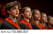 School Choir Performance: A chorus of young voices, dressed in robes, sing with concentration at end of year recital. Стоковое AI-изображение, AI-художник Данила Большаков / Фотобанк Лори