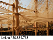 Wooden masts and nets creating a pattern on a ship. Стоковое AI-изображение, AI-художник Иван Рябоконь / Фотобанк Лори
