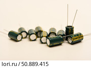 Electrolytic capacitors of different nominal values. Energy storage devices. Electronic radio elements. Стоковое фото, фотограф Valeriy Lushchikov / Фотобанк Лори