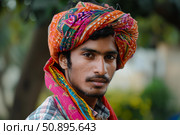 Young indian farmer wearing traditional turban and scarf. Стоковое AI-изображение, AI-художник Иван Рябоконь / Фотобанк Лори