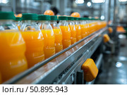 Orange juice bottling plant conveyor belt carrying freshly squeezed juice bottles. Стоковое AI-изображение, AI-художник Иван Рябоконь / Фотобанк Лори