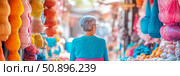 Vibrant cultural bazaar exploration by an elderly traveler amidst colorful handcrafted wares, suitable for travel brochure, guide, web banner. Стоковое AI-изображение, AI-художник Данила Большаков / Фотобанк Лори