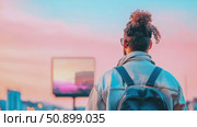 Lone individual with a distinctive top knot contemplating a beautiful twilight sky above a city. Стоковое AI-видео, аниматор Данила Большаков / Фотобанк Лори