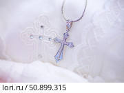 Christian cross to wear on the body after baptism. Стоковое фото, фотограф Наталия Кирсанова / Фотобанк Лори