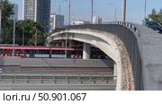 A bridge over a highway with cars and trucks driving on it. Russia. Moscow. 25.07.25. Редакционное видео, видеограф Ярославский Максим / Фотобанк Лори