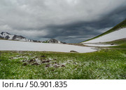 Natural rock formation on a green valley and snow riwer. Стоковое фото, фотограф Саблин Станислав / Фотобанк Лори