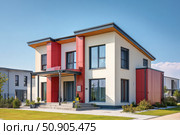 House Exterior. Roof Window. Second floor among blue sky. Mansard attic. Newly build houses. Gable roof with skylight, asphalt roofing, shingles. Residential Home. Vinyl Siding. Polymeric roof-tiles. Стоковое AI-изображение, AI-художник Марина Демидюк / Фотобанк Лори