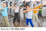 Girl learn to dance modern dances, doing movement with unrecognizable teacher. Стоковое фото, фотограф Яков Филимонов / Фотобанк Лори