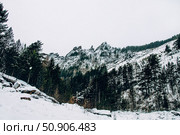 Landscape of Siberia mountains Stolbi, rock peak Takmak range in haze winter. Стоковое фото, фотограф Spirit River / Фотобанк Лори
