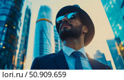 Urban Ambition: Portrait of a businessman in suit looking up at tall buildings. Стоковое AI-изображение, AI-художник Данила Большаков / Фотобанк Лори