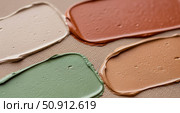 Cosmetic swatches of foundation and concealer on textured background, makeup cream smears in different skin tone colors, beauty and skincare product concept. Стоковое AI-изображение, AI-художник Павел Муравьев / Фотобанк Лори