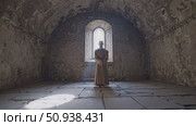 Robed monk meditating inside medieval stone chapel, soft sunlight illuminating worn walls, radiating peaceful spiritual contemplation. Стоковое AI-видео, аниматор Данил Руденко / Фотобанк Лори