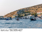 Balaklava, Crimea, 21 Jule 2020, Boats in port of seaside city on Black Sea. Редакционное фото, фотограф Spirit River / Фотобанк Лори
