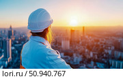 Construction: Female engineer overseeing city at sunrise. Стоковое AI-изображение, AI-художник Данила Большаков / Фотобанк Лори