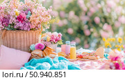 A vibrant picnic setting with flowers and light refreshments outdoors. Стоковое AI-изображение, AI-художник Данила Большаков / Фотобанк Лори