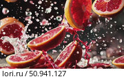 Juicy grapefruit slices bursting with citrus freshness, spraying vibrant liquid droplets against deep shadowy background. Стоковое AI-видео, аниматор Данил Руденко / Фотобанк Лори