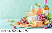 Elegant wine and cheese arrangement for a refined tasting experience, suitable for print, card, poster. Стоковое AI-изображение, AI-художник Данила Большаков / Фотобанк Лори