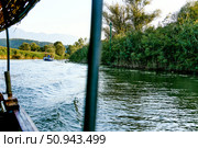 Wooden boat yacht sailing on water Skadar Lake in Montenegro, summer landscape (2024 год). Стоковое фото, фотограф Spirit River / Фотобанк Лори