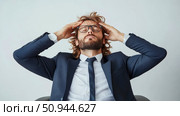 Stressed Businessman: Depicting pressure and headache, design to illustrate professional burnout, fatigue, and mental health awareness campaigns. Стоковое AI-изображение, AI-художник Данила Большаков / Фотобанк Лори