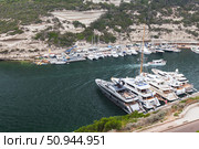 Luxury Yachts and Boats Docked in a Picturesque Marina of Bonifacio, Corsica (2018 год). Стоковое фото, фотограф EugeneSergeev / Фотобанк Лори