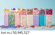 Concept: Artisan soap assortment with natural inclusions for skincare. Purpose: Promotion for bath product. Стоковое AI-изображение, AI-художник Данила Большаков / Фотобанк Лори