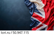 Concept: Patriotism. Union Jack flag draped on dark blue backdrop. Стоковое AI-изображение, AI-художник Данила Большаков / Фотобанк Лори