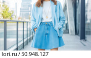 Fashionable Woman in Denim Skirt and Light Blue Jacket for Print Ad. Стоковое AI-изображение, AI-художник Данила Большаков / Фотобанк Лори