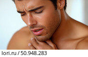 Portrait of a man experiencing throat discomfort, a design element showcasing physical ailment, sore throat, or health awareness. Стоковое AI-изображение, AI-художник Данила Большаков / Фотобанк Лори