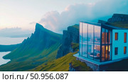 Contemporary cliffside abode with panoramic glass views overlooking a tranquil fjord and majestic mountains, peaceful retreat for serene living. Стоковое AI-изображение, AI-художник Данила Большаков / Фотобанк Лори