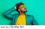 A vibrant portrait of a confident young man with dreadlocks, wearing bold yellow and teal attire with striking green sunglasses, exuding a cool and trendy persona for fashion promotion. Стоковое AI-изображение, AI-художник Данила Большаков / Фотобанк Лори