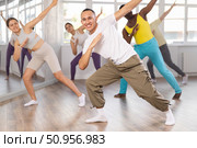European guy with team of like-minded multinational people learn to elements of hip hop dance. Стоковое фото, фотограф Яков Филимонов / Фотобанк Лори