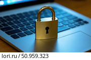 A laptop with a gold lock on it. Стоковое фото, фотограф Ярославский Максим / Фотобанк Лори