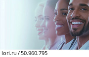 A cheerful and diverse group of medical professionals, including a smiling male doctor, symbolizing unity and compassionate healthcare, suited for clinic banners or health service promotional content. Стоковое AI-изображение, AI-художник Данила Большаков / Фотобанк Лори